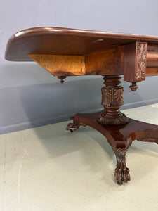 Circa 1845 Anthony Querville drop-leaf table in rich mahogany with carved pedestal base, acanthus detailing, and claw feet—classic American Empire antique furniture