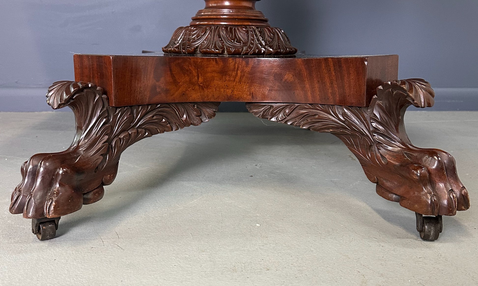 Circa 1845 Anthony Querville drop-leaf table in rich mahogany with carved pedestal base, acanthus detailing, and claw feet—classic American Empire antique furniture