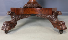 Load image into Gallery viewer, Circa 1845 Anthony Querville drop-leaf table in rich mahogany with carved pedestal base, acanthus detailing, and claw feet—classic American Empire antique furniture