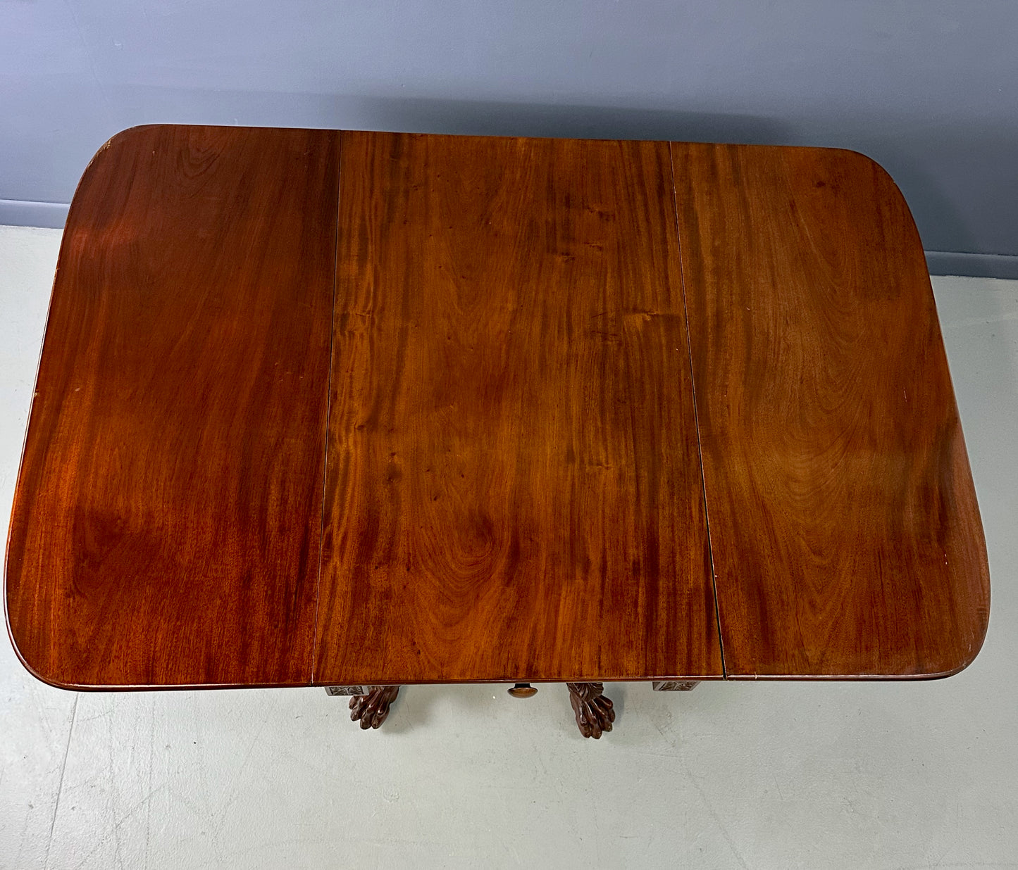 Circa 1845 Anthony Querville drop-leaf table in rich mahogany with carved pedestal base, acanthus detailing, and claw feet—classic American Empire antique furniture