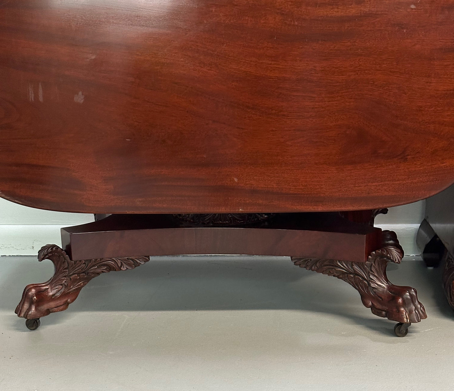 Circa 1845 Anthony Querville drop-leaf table in rich mahogany with carved pedestal base, acanthus detailing, and claw feet—classic American Empire antique furniture