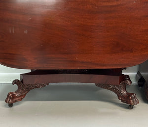 Circa 1845 Anthony Querville drop-leaf table in rich mahogany with carved pedestal base, acanthus detailing, and claw feet—classic American Empire antique furniture