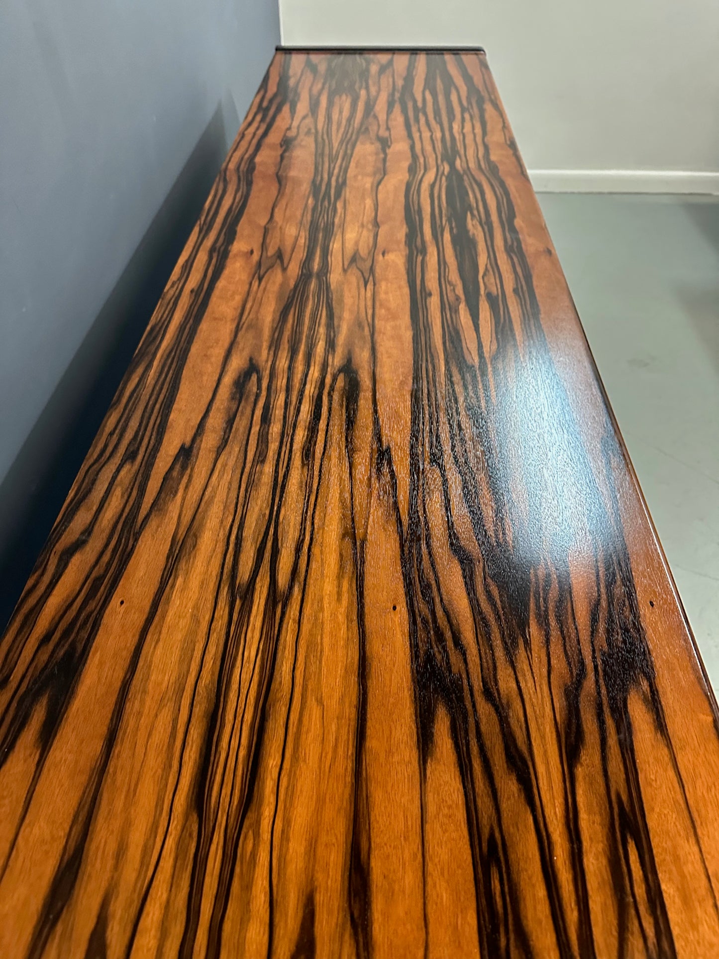 Mid-century modern sideboard with high-gloss Macassar ebony veneer and chrome accent