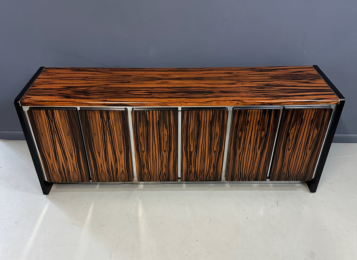 Mid-century modern sideboard with high-gloss Macassar ebony veneer and chrome accent