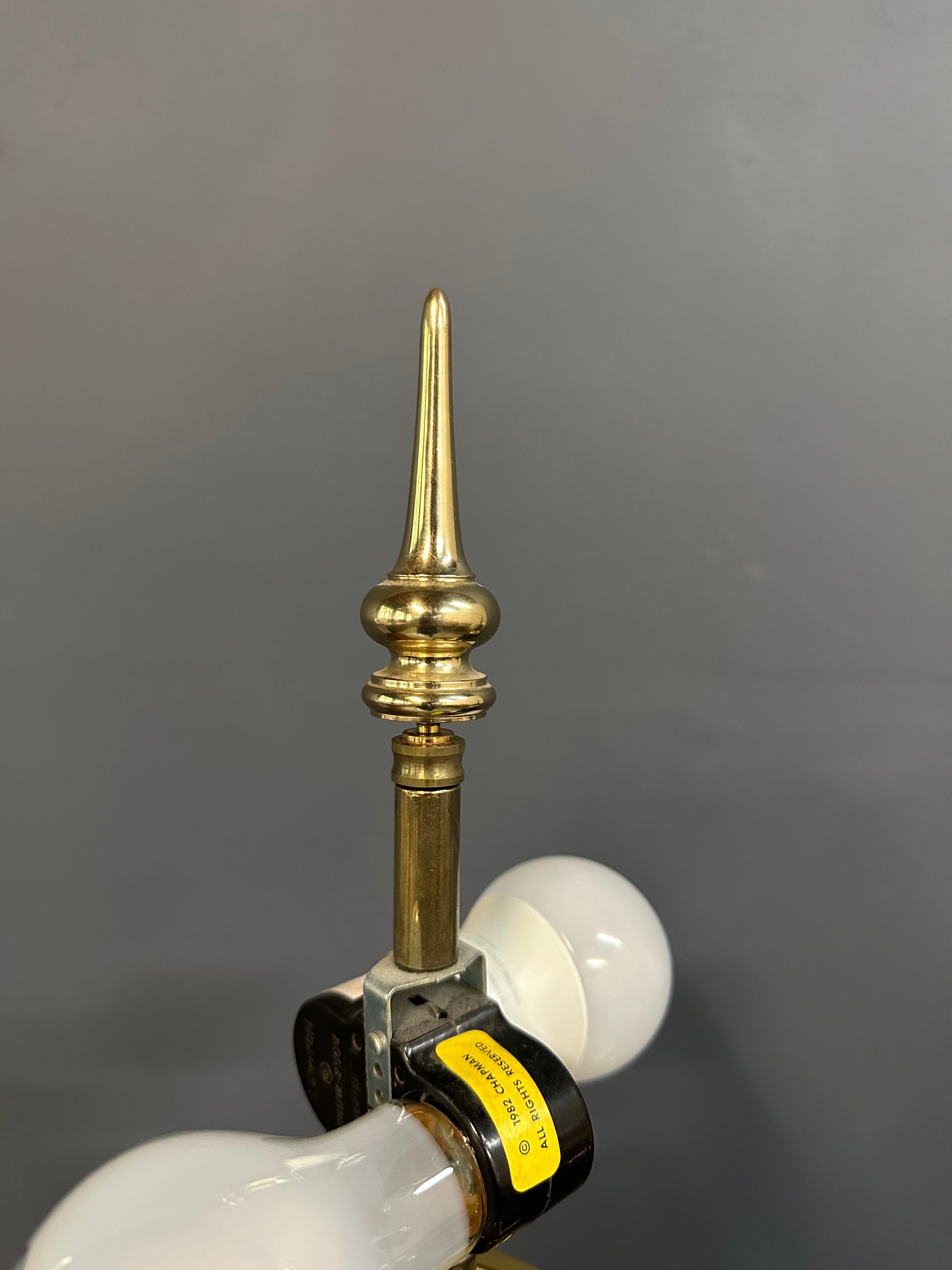 Pair of Hollywood Regency Black Ceramic Urn Lamps with Stepped Brass Bases by Chapman