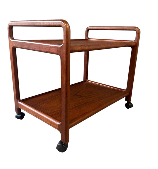 Vintage Danish teak mid-century modern bar cart or drinks trolley with two-tier design, rolling wheels, and minimalist Scandinavian style