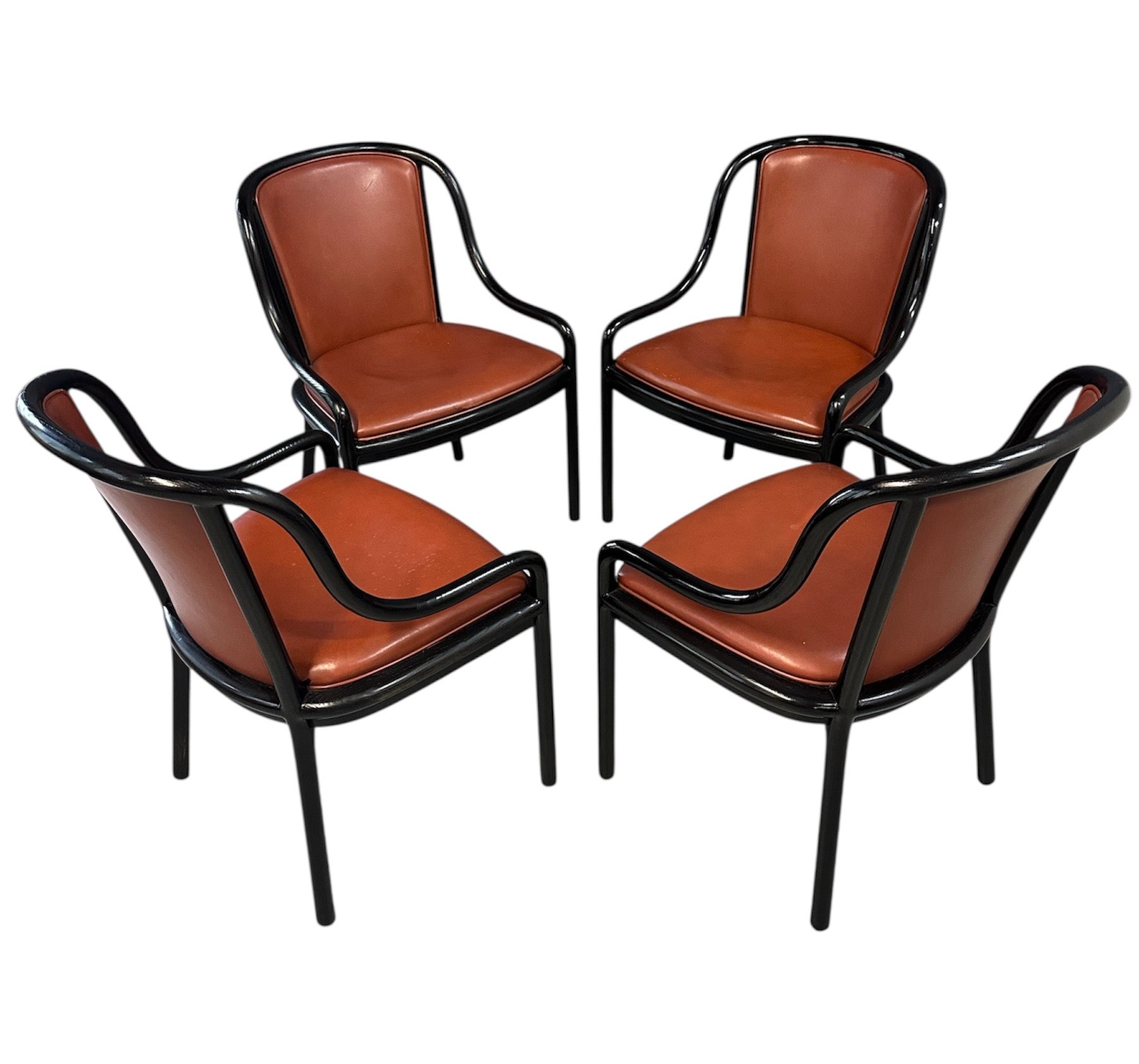 Set of four rare 1970s Ward Bennett Landmark Variation chairs for Brickel Associates, featuring black lacquered frames and rust leather upholstery—mid-century modern design
