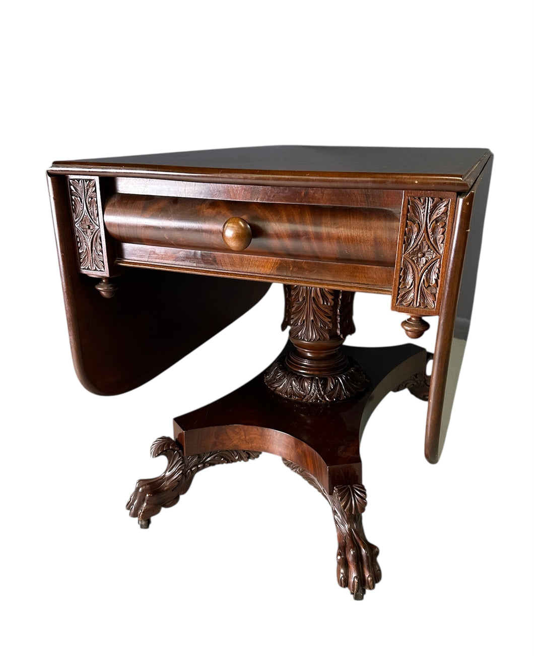 Circa 1845 Anthony Querville drop-leaf table in rich mahogany with carved pedestal base, acanthus detailing, and claw feet—classic American Empire antique furniture