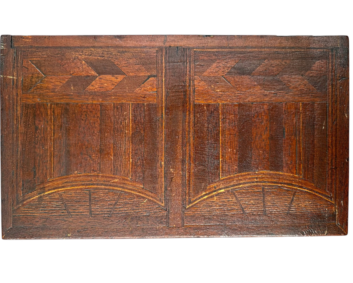 Miniature marquetry blanket chest dated 1910, handcrafted by Flora Boyer of Pennsylvania, featuring intricate geometric inlay patterns in warm-toned wood and a brass keyhole on the front
