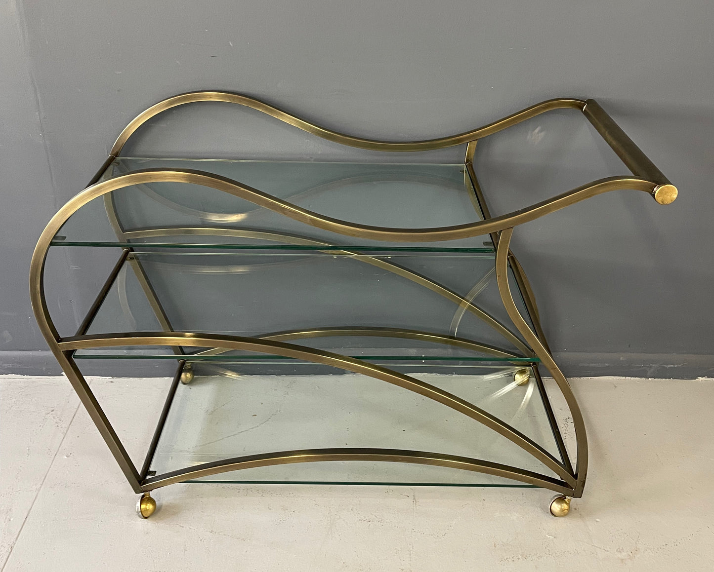 SOLD – Curvaceous Bar Cart in Brass for Design Institute of America by Milo Baughman