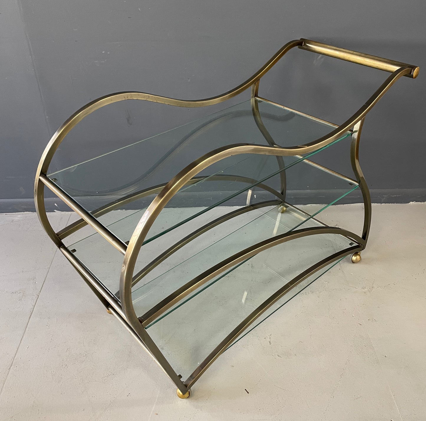 SOLD – Curvaceous Bar Cart in Brass for Design Institute of America by Milo Baughman