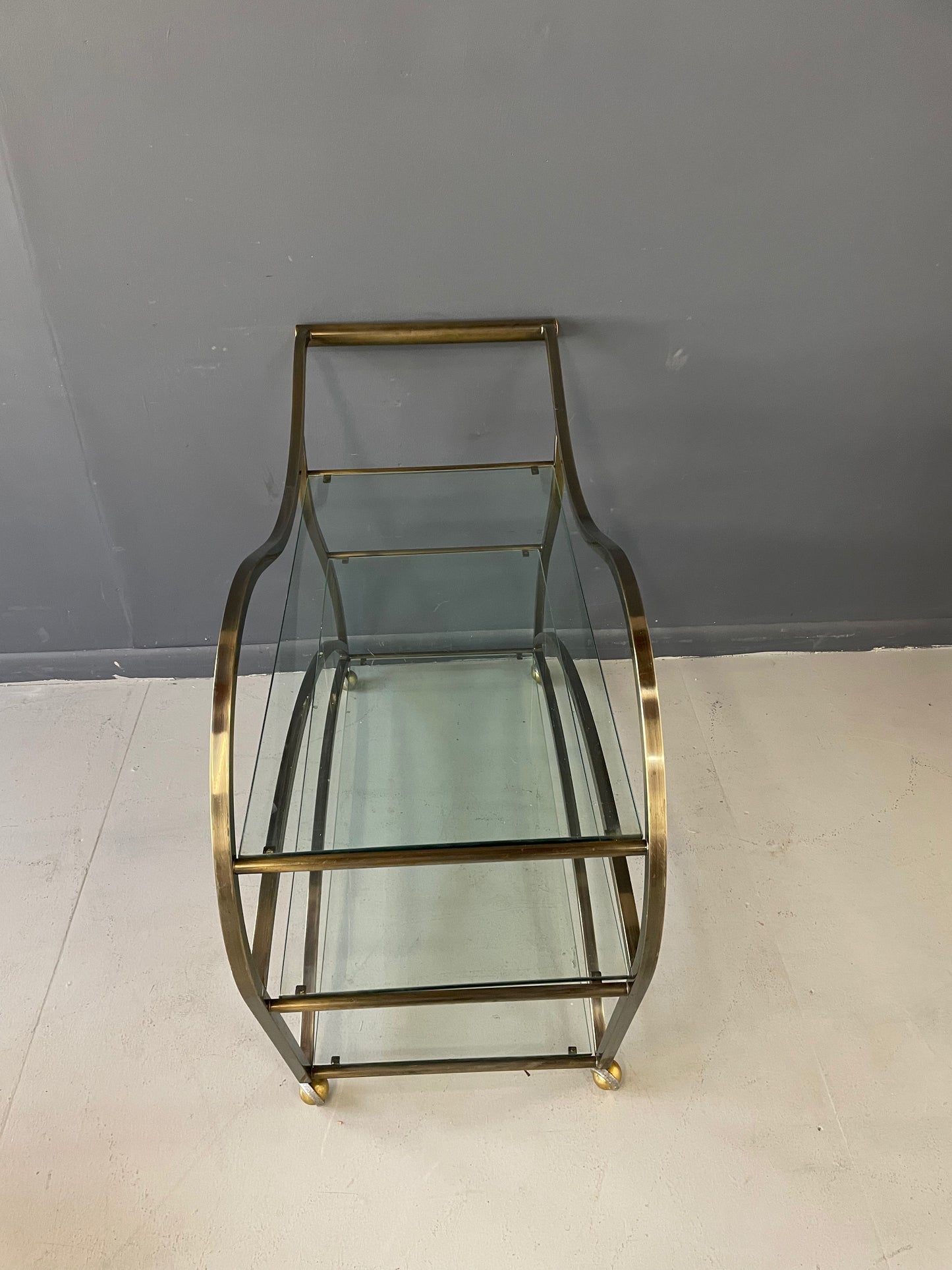 SOLD – Curvaceous Bar Cart in Brass for Design Institute of America by Milo Baughman