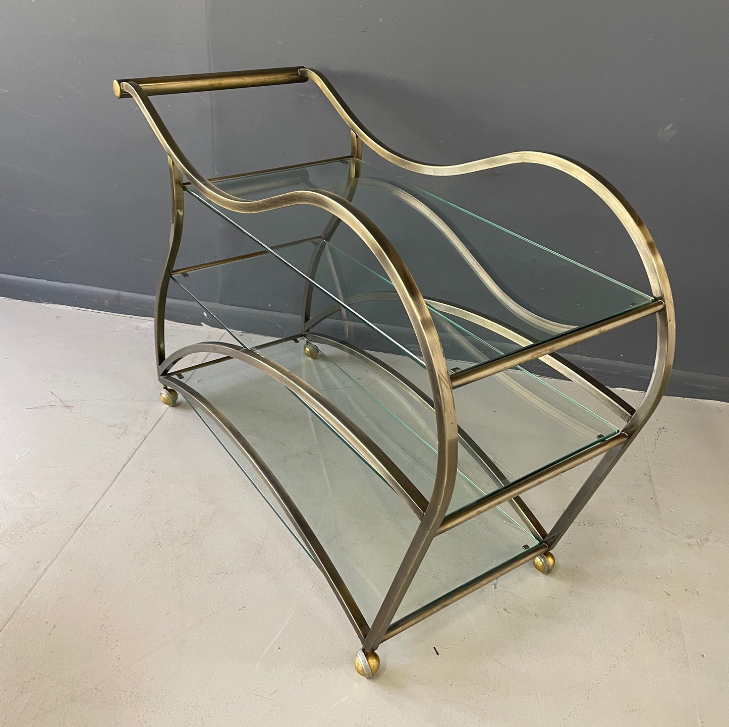 SOLD – Curvaceous Bar Cart in Brass for Design Institute of America by Milo Baughman