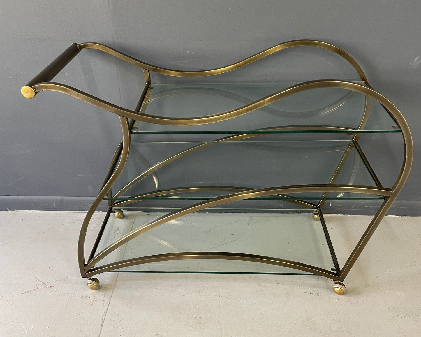 SOLD – Curvaceous Bar Cart in Brass for Design Institute of America by Milo Baughman