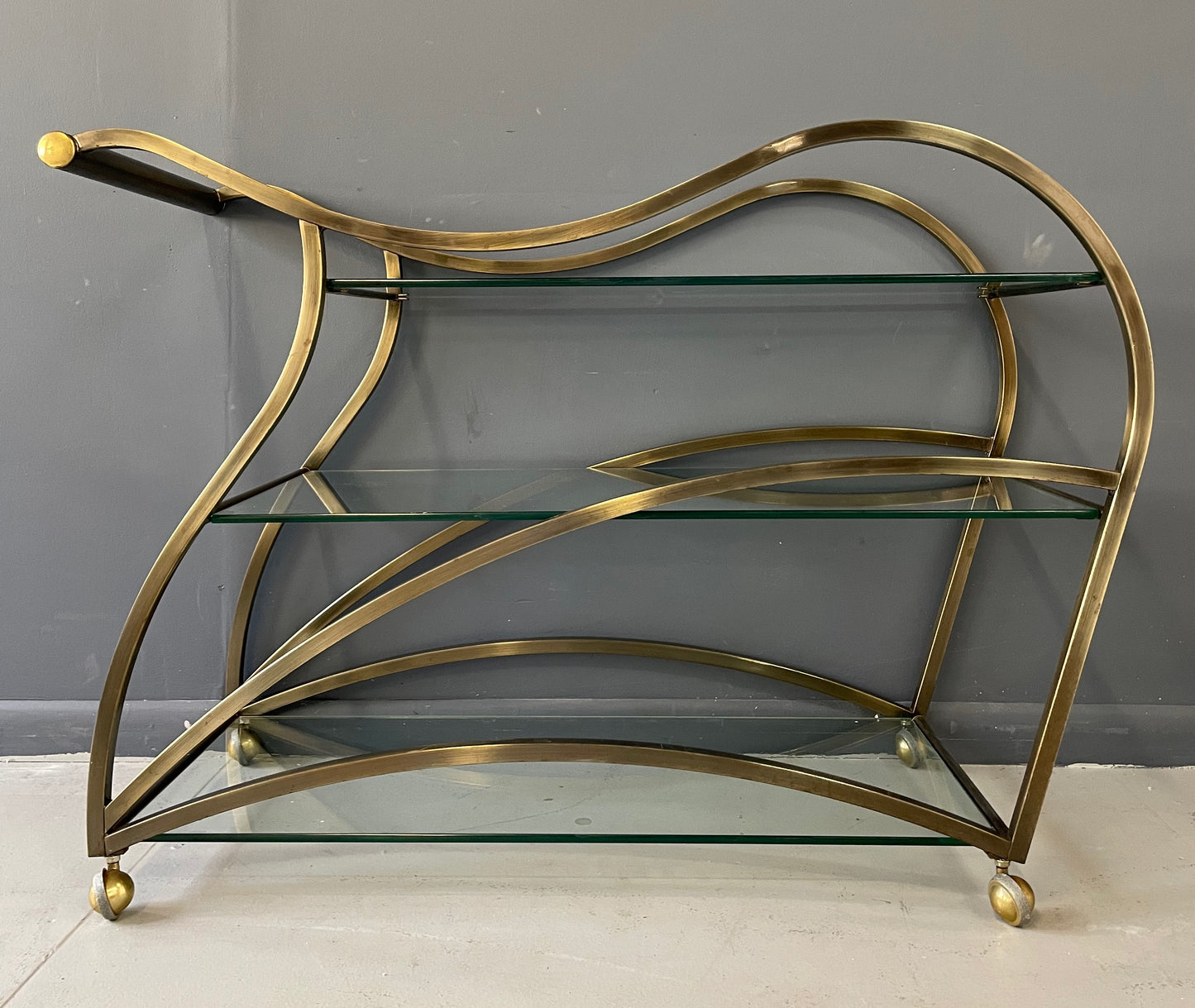 SOLD – Curvaceous Bar Cart in Brass for Design Institute of America by Milo Baughman