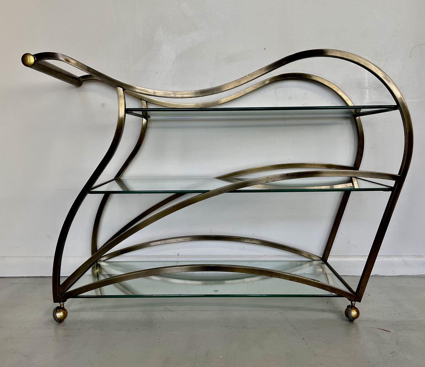 SOLD – Curvaceous Bar Cart in Brass for Design Institute of America by Milo Baughman