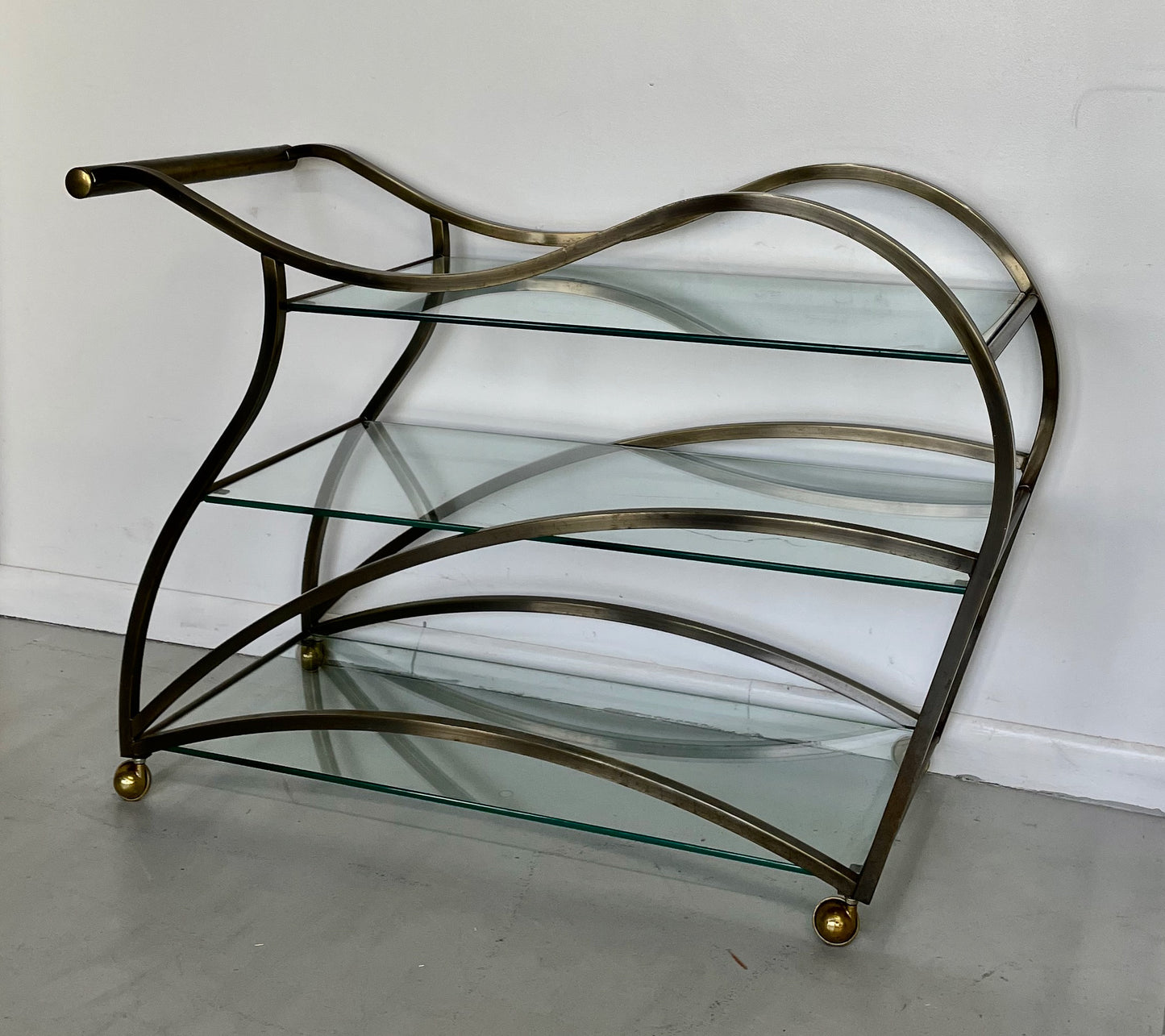 SOLD – Curvaceous Bar Cart in Brass for Design Institute of America by Milo Baughman